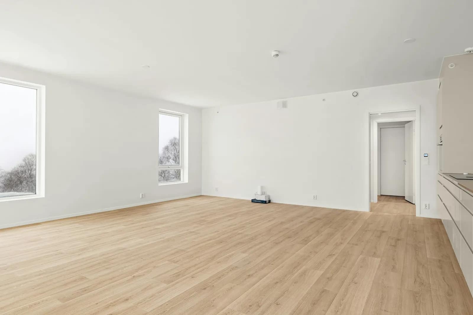 Open living area, empty, as photographed